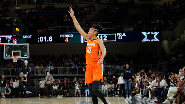 Candace Paker celebrates a made shot.